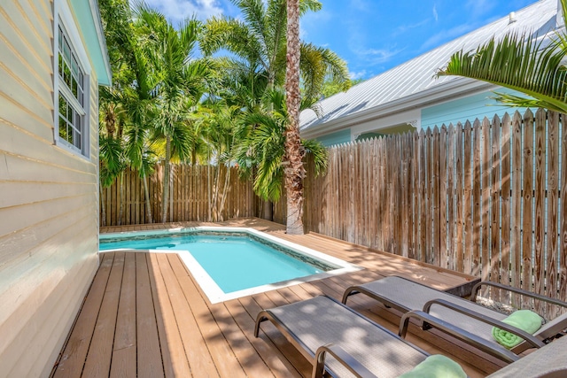 view of swimming pool with a wooden deck