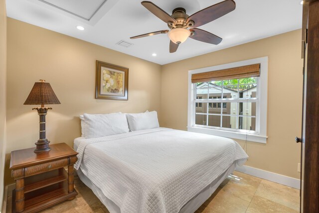 bedroom featuring ceiling fan and light tile patterned floors