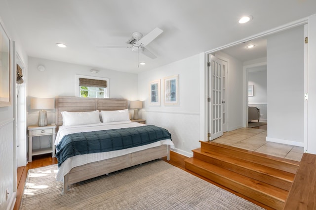 bedroom featuring ceiling fan and light hardwood / wood-style floors