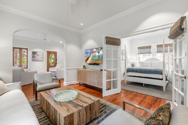 living room featuring hardwood / wood-style flooring, ceiling fan, and french doors