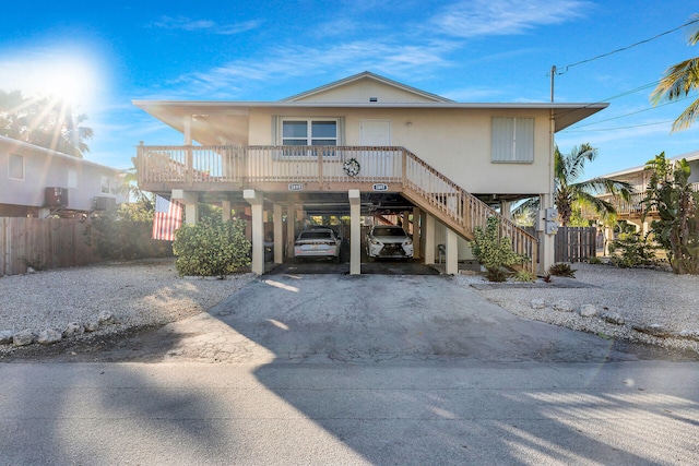 coastal inspired home featuring a carport