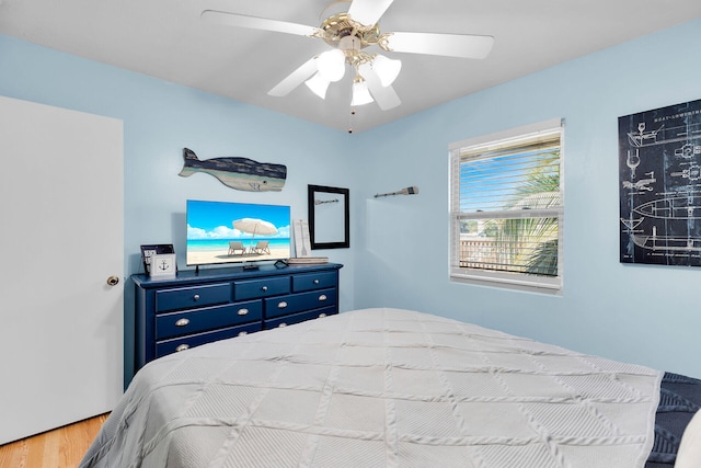 bedroom featuring wood-type flooring and ceiling fan