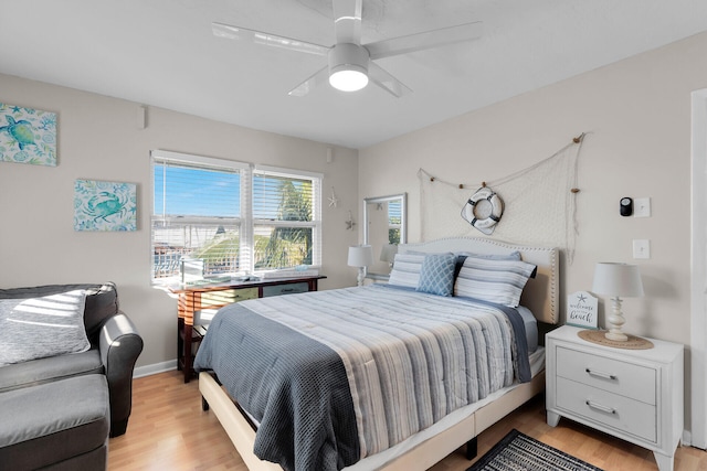 bedroom featuring light hardwood / wood-style flooring and ceiling fan