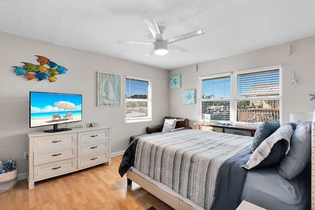 bedroom with ceiling fan and light hardwood / wood-style floors