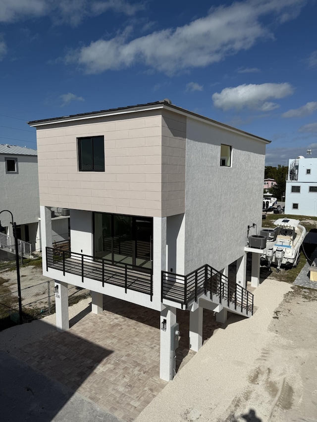 rear view of property featuring a balcony