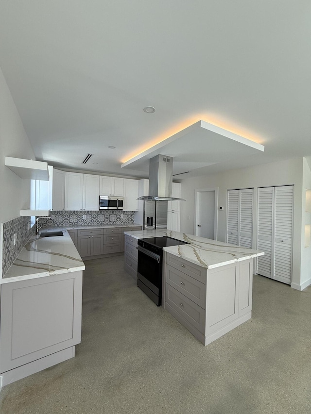 kitchen featuring black electric range oven, gray cabinetry, white cabinetry, island range hood, and a center island