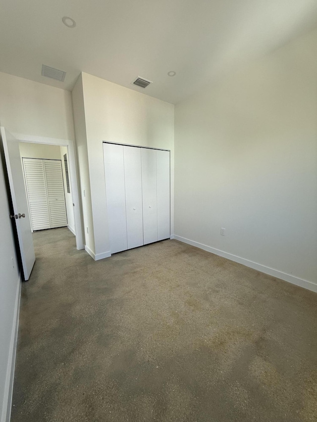 unfurnished bedroom with a closet