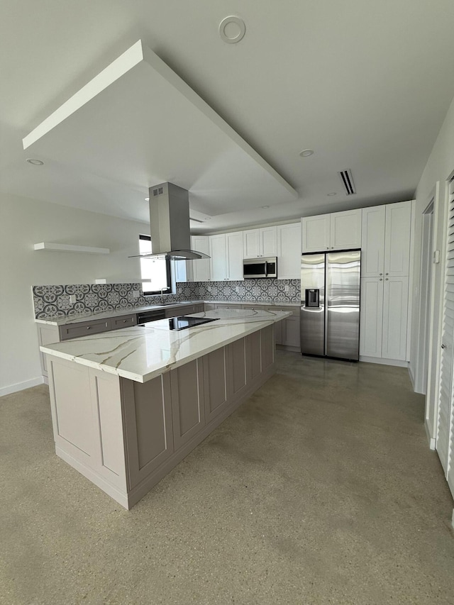 kitchen with white cabinetry, stainless steel appliances, light stone countertops, and island range hood