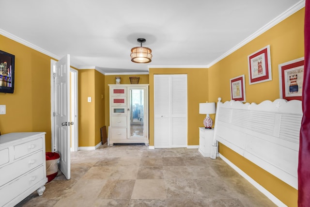 interior space featuring ornamental molding and a closet