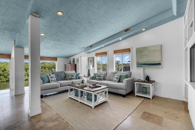 living room with vaulted ceiling and a textured ceiling