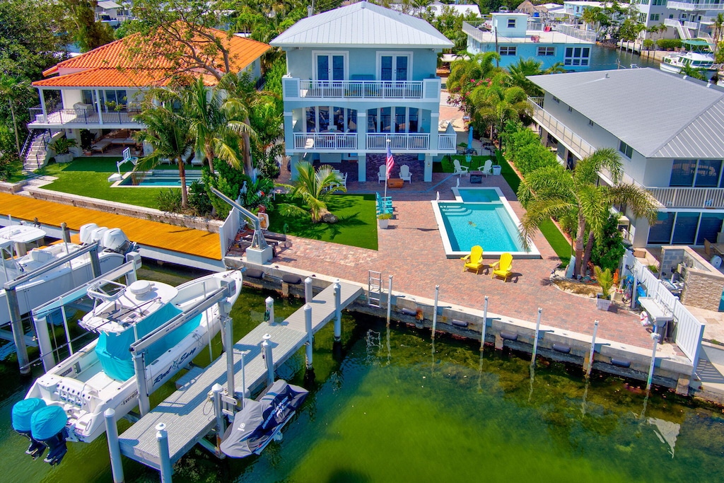 birds eye view of property featuring a water view