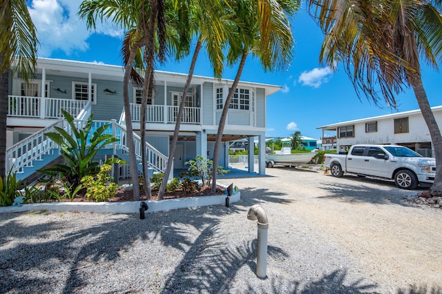 306 N Anglers Dr Unit B, Marathon, FL 33050 - view of front of house featuring stairs and covered porch