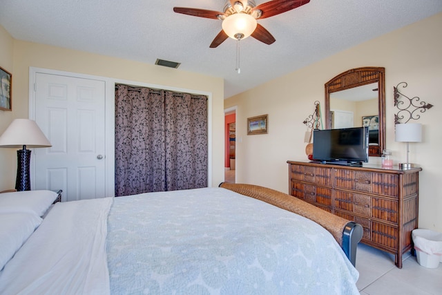 306 N Anglers Dr Unit B, Marathon, FL 33050 - tiled bedroom featuring a ceiling fan and a textured ceiling
