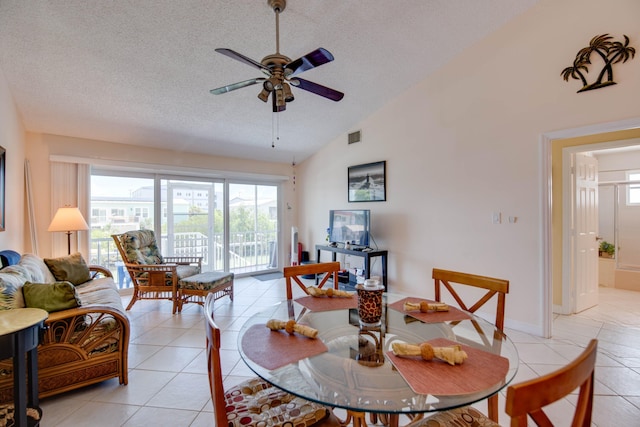306 N Anglers Dr Unit B, Marathon, FL 33050 - dining room featuring a ceiling fan, a textured ceiling, lofted ceiling, and light tile patterned floors