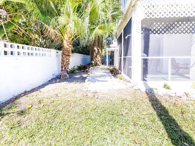 view of yard with a sunroom