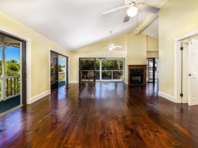 unfurnished living room featuring a premium fireplace, a healthy amount of sunlight, and dark hardwood / wood-style flooring