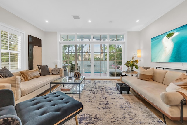 living room featuring crown molding