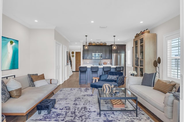 living room featuring ornamental molding and dark hardwood / wood-style flooring