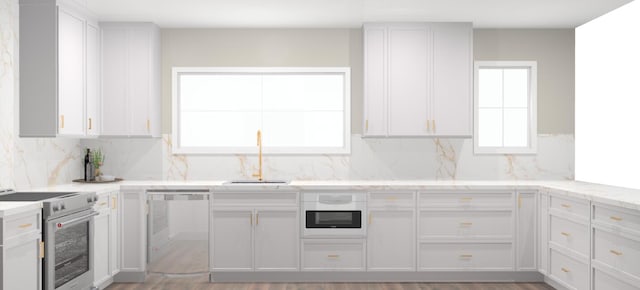 30 Key Haven Rd, Key Haven, FL 33040 - kitchen with stainless steel appliances, a sink, tasteful backsplash, and white cabinets