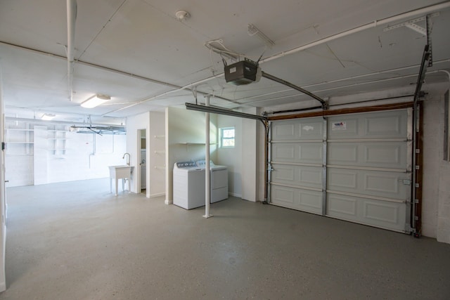 garage featuring washing machine and clothes dryer and a garage door opener
