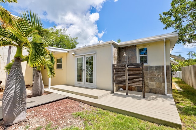 back of property featuring a deck