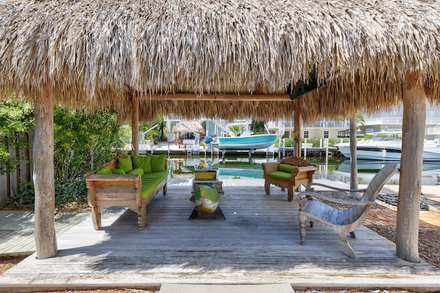 dock area with a gazebo and a water view