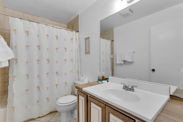 511 9th St, Key Colony, FL 33051 - bathroom featuring toilet, vanity, and shower / tub combo