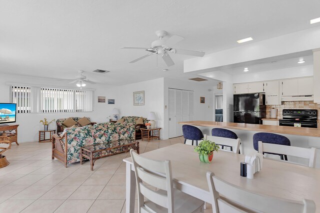 511 9th St, Key Colony, FL 33051 - dining area with light tile patterned floors and a ceiling fan