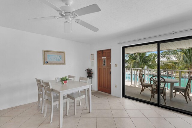 511 9th St, Key Colony, FL 33051 - dining space featuring ceiling fan, baseboards, and light tile patterned floors