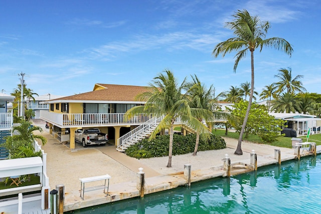 511 9th St, Key Colony, FL 33051 - back of house featuring stairway