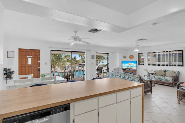 511 9th St, Key Colony, FL 33051 - kitchen with stainless steel dishwasher, ceiling fan, wood counters, and open floor plan