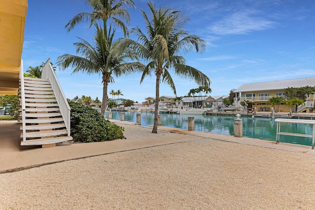 511 9th St, Key Colony, FL 33051 - view of pool featuring stairway and a water view