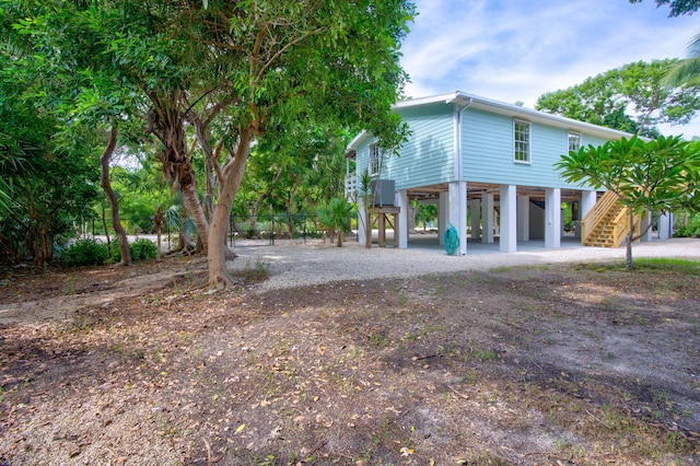 view of side of home with a carport