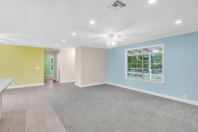 empty room featuring ornamental molding and ceiling fan