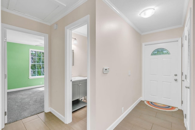 entryway with crown molding and light colored carpet