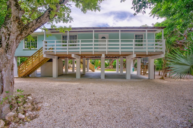 back of house with a carport