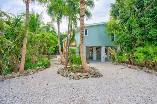 view of side of property featuring a carport