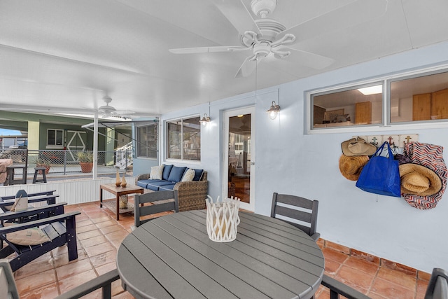 sunroom with a wealth of natural light and ceiling fan