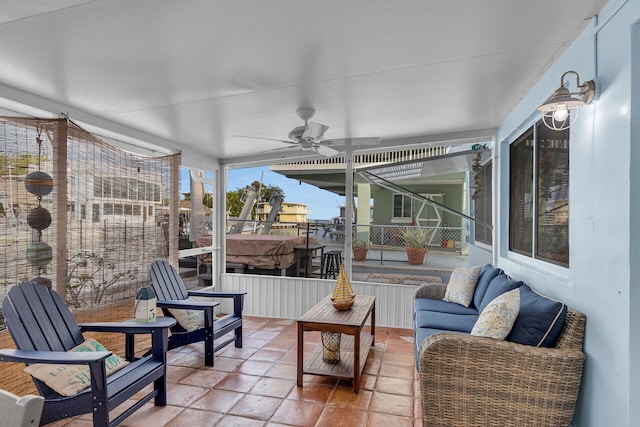 sunroom featuring ceiling fan