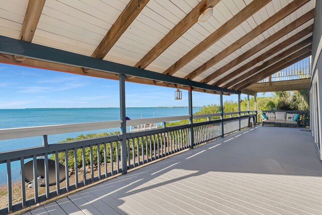 wooden terrace with a water view