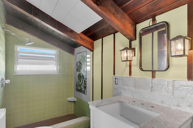 bathroom with lofted ceiling with beams, vanity, wood ceiling, and toilet