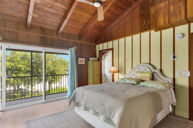 bedroom featuring vaulted ceiling with beams, wood ceiling, access to outside, and wooden walls