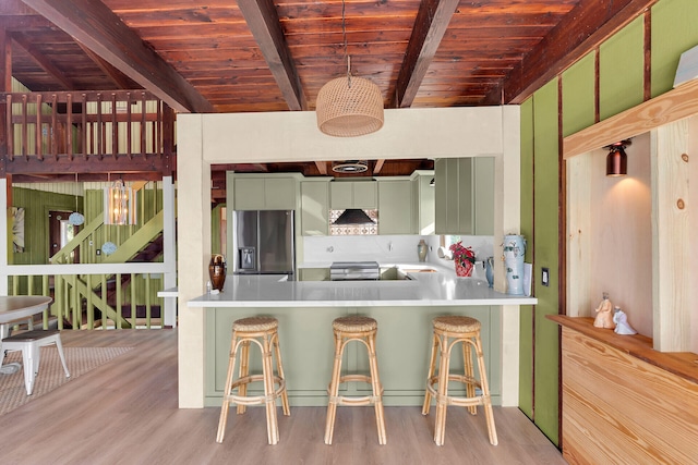 kitchen featuring wood ceiling, kitchen peninsula, stainless steel fridge with ice dispenser, and light wood-type flooring