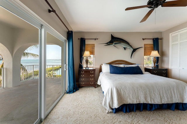 228 W Seaview Cir, Duck, FL 33050 - bedroom with access to outside, carpet flooring, a ceiling fan, a closet, and a water view