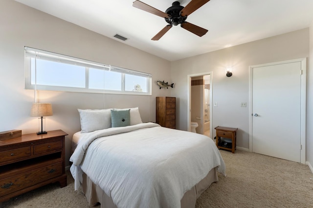 228 W Seaview Cir, Duck, FL 33050 - bedroom with light carpet, a ceiling fan, connected bathroom, and baseboards