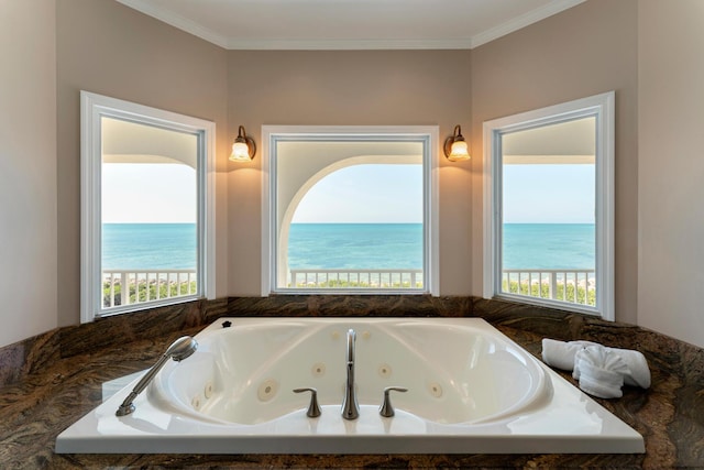 228 W Seaview Cir, Duck, FL 33050 - bathroom featuring a jetted tub, plenty of natural light, ornamental molding, and a water view
