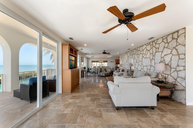 228 W Seaview Cir, Duck, FL 33050 - living room with stone tile floors, ceiling fan, and recessed lighting
