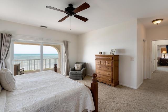 228 W Seaview Cir, Duck, FL 33050 - bedroom with light colored carpet, access to outside, a ceiling fan, baseboards, and a water view