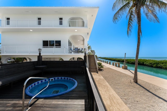 228 W Seaview Cir, Duck, FL 33050 - view of swimming pool featuring a water view, an outdoor hot tub, and stairway