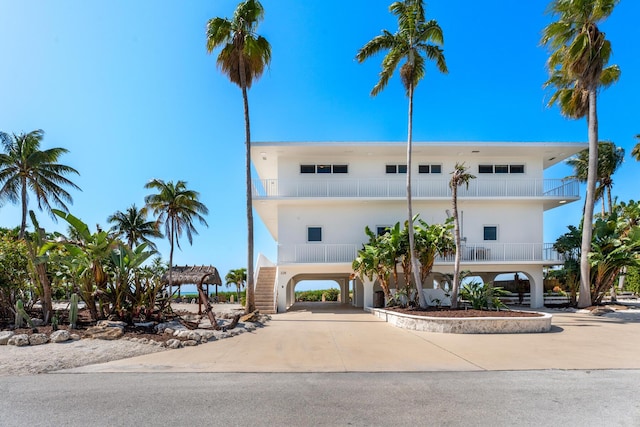 228 W Seaview Cir, Duck, FL 33050 - view of property featuring a carport, stairs, and driveway
